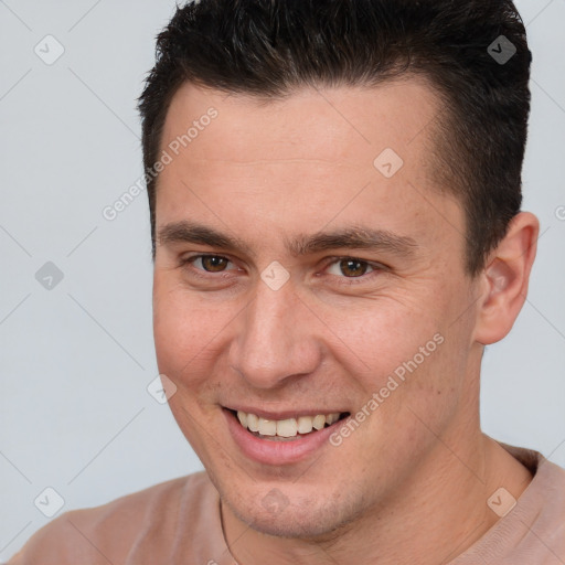 Joyful white young-adult male with short  brown hair and brown eyes