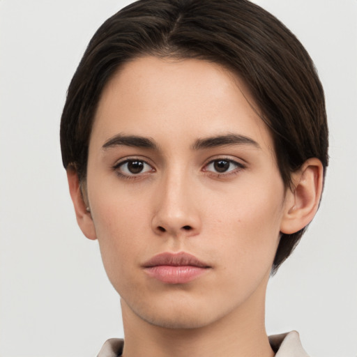 Neutral white young-adult female with short  brown hair and brown eyes