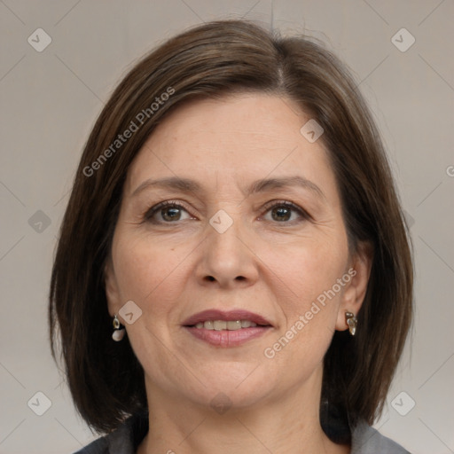 Joyful white adult female with medium  brown hair and grey eyes