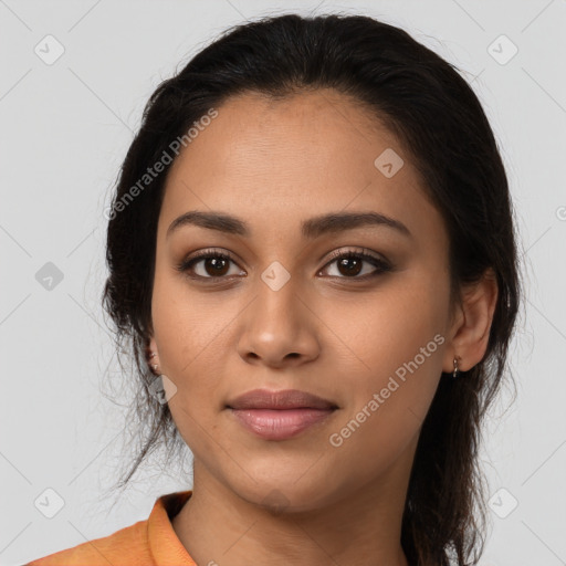 Joyful latino young-adult female with medium  brown hair and brown eyes