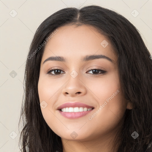 Joyful latino young-adult female with long  black hair and brown eyes