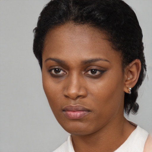 Neutral black young-adult female with short  black hair and brown eyes