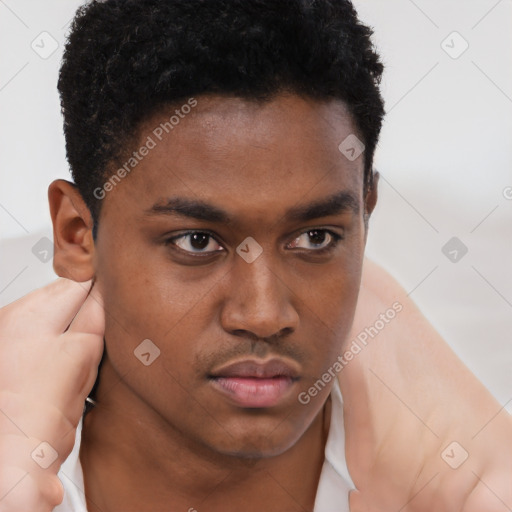 Neutral black young-adult male with short  brown hair and brown eyes