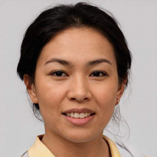 Joyful asian young-adult female with medium  brown hair and brown eyes