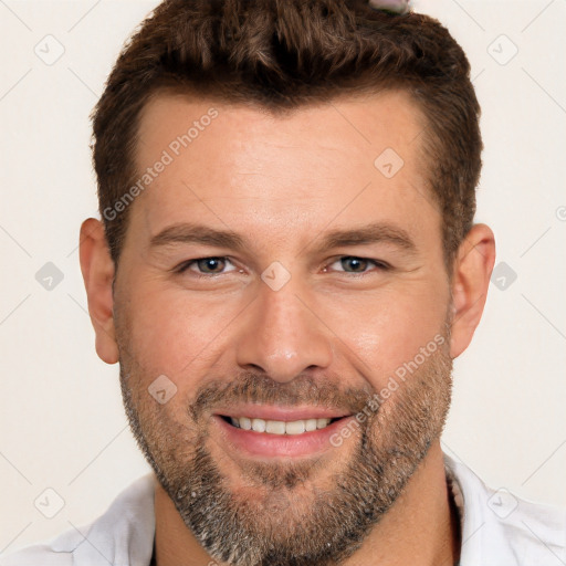 Joyful white adult male with short  brown hair and brown eyes