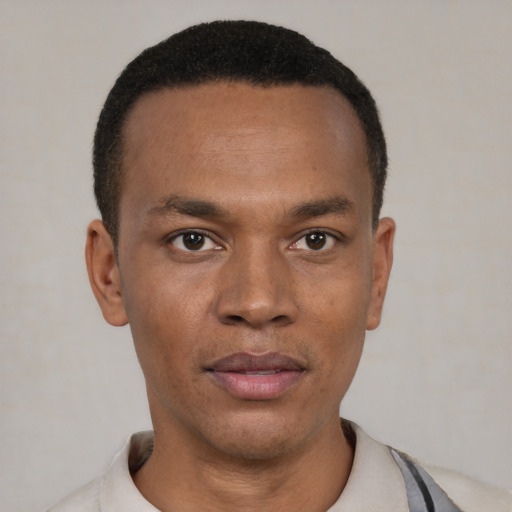 Neutral latino young-adult male with short  black hair and brown eyes