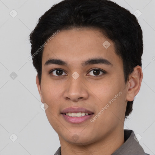 Joyful latino young-adult male with short  black hair and brown eyes