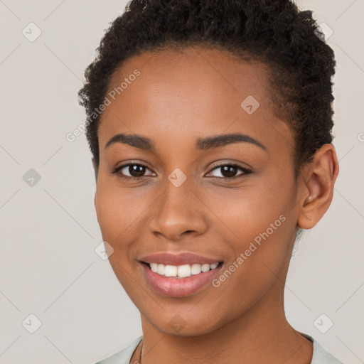 Joyful latino young-adult female with short  brown hair and brown eyes