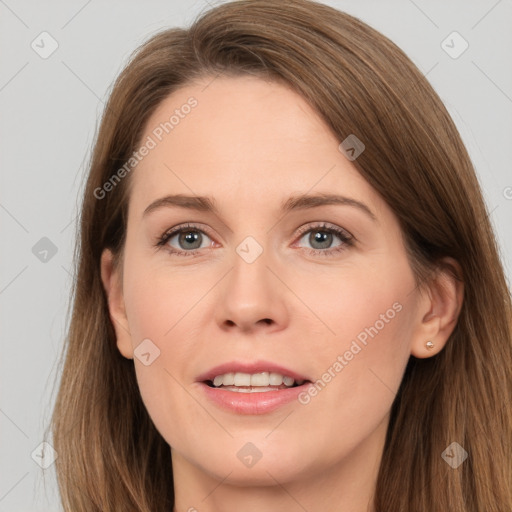 Joyful white adult female with long  brown hair and brown eyes