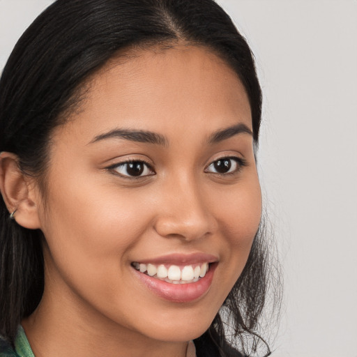 Joyful white young-adult female with long  brown hair and brown eyes