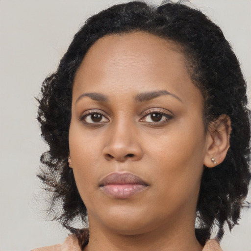 Neutral black young-adult female with long  black hair and brown eyes