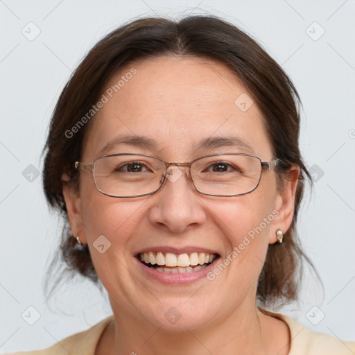 Joyful white adult female with medium  brown hair and grey eyes