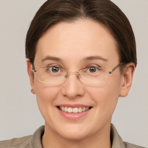 Joyful white adult female with short  brown hair and brown eyes