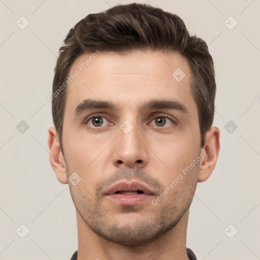 Neutral white young-adult male with short  brown hair and brown eyes