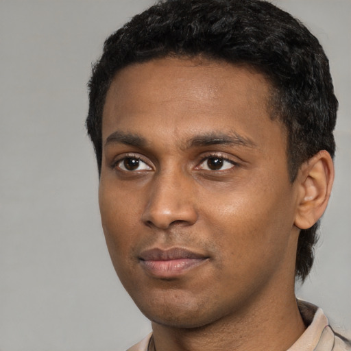 Neutral black young-adult male with short  black hair and brown eyes