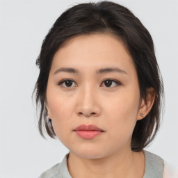 Neutral asian young-adult female with medium  brown hair and brown eyes