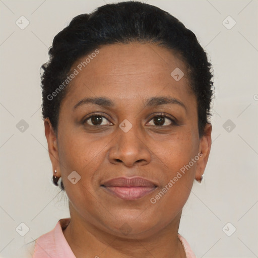 Joyful black adult female with short  brown hair and brown eyes