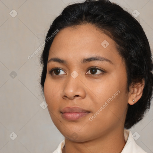 Joyful latino young-adult female with medium  black hair and brown eyes