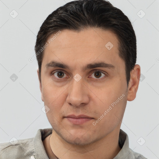 Joyful white young-adult male with short  brown hair and brown eyes