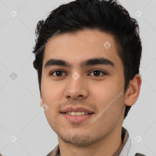 Joyful latino young-adult male with short  brown hair and brown eyes