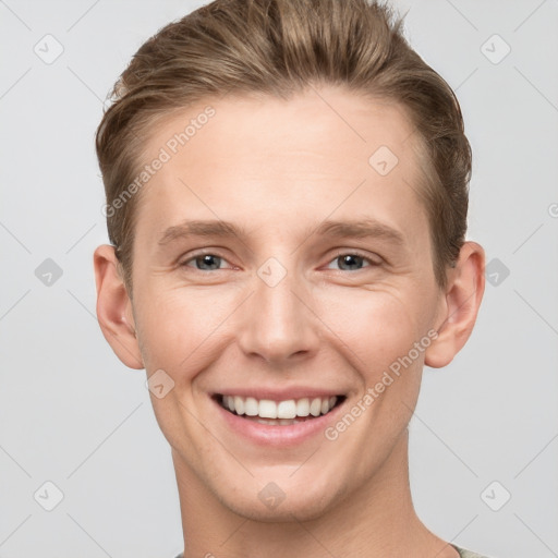 Joyful white young-adult female with short  brown hair and grey eyes