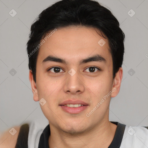 Joyful asian young-adult male with short  brown hair and brown eyes