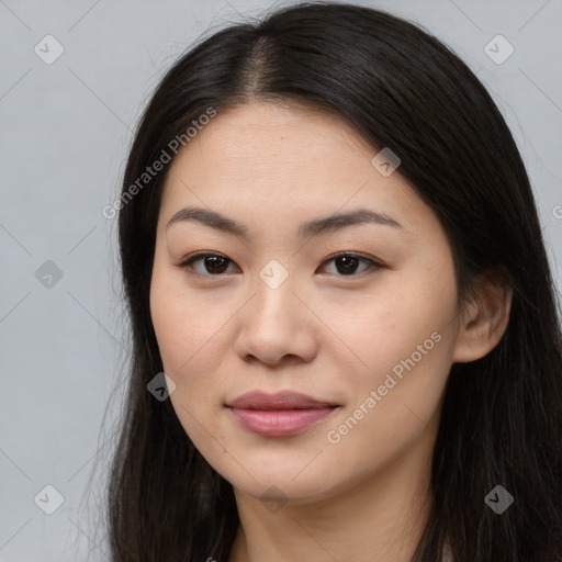 Joyful asian young-adult female with long  brown hair and brown eyes