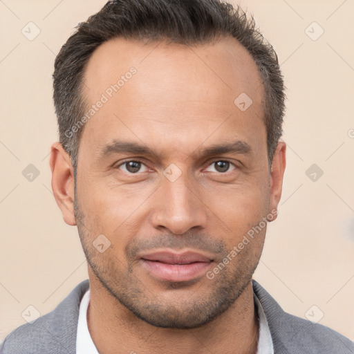 Joyful white adult male with short  brown hair and brown eyes