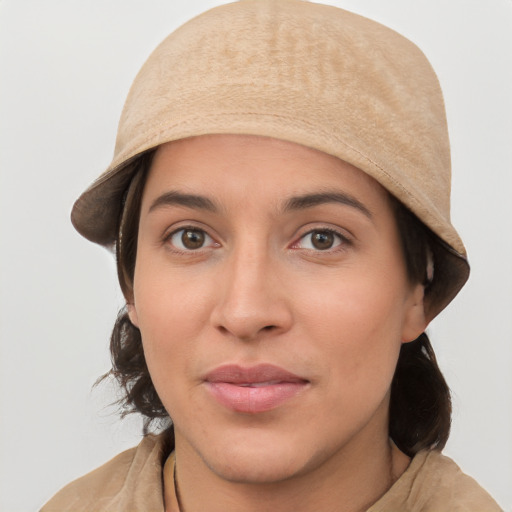 Joyful white young-adult female with medium  brown hair and grey eyes