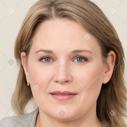 Joyful white adult female with long  brown hair and grey eyes