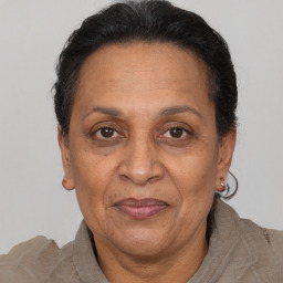 Joyful white adult female with short  brown hair and brown eyes
