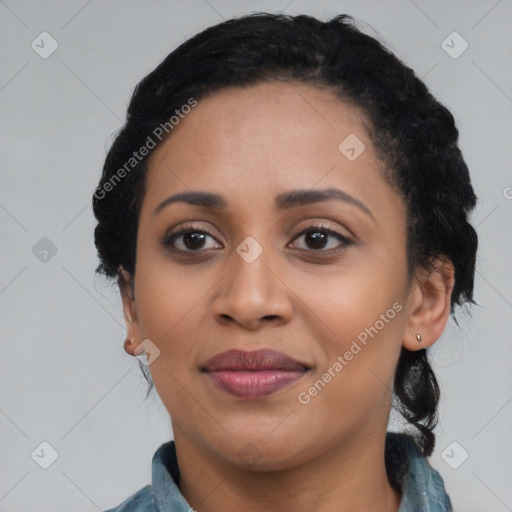 Joyful black young-adult female with medium  black hair and brown eyes