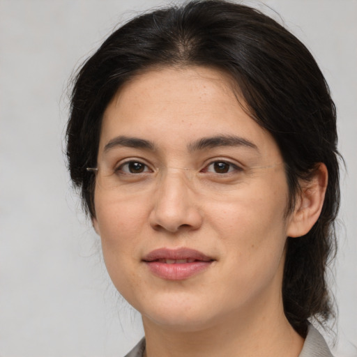 Joyful white young-adult female with medium  brown hair and brown eyes