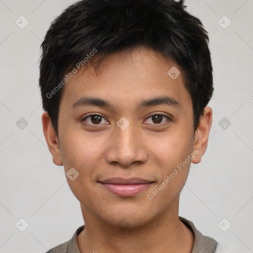 Joyful asian young-adult male with short  brown hair and brown eyes