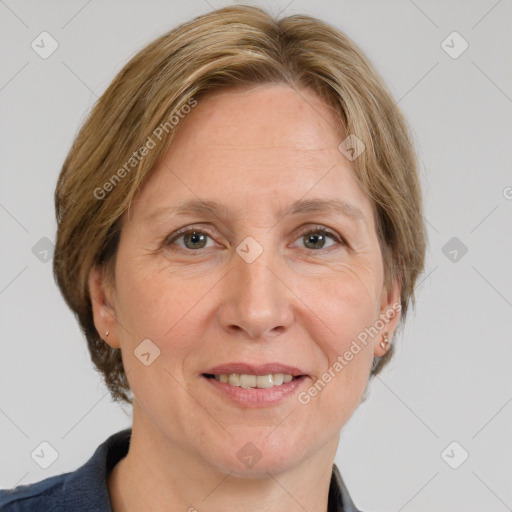 Joyful white adult female with medium  brown hair and grey eyes