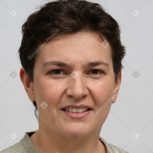 Joyful white adult female with short  brown hair and grey eyes