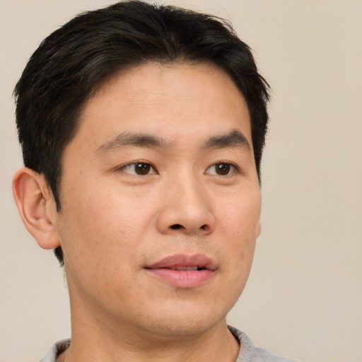 Neutral asian young-adult male with short  brown hair and brown eyes