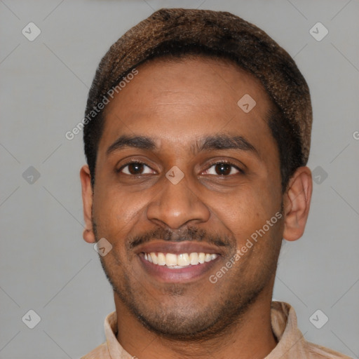 Joyful latino young-adult male with short  black hair and brown eyes