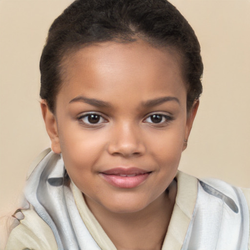 Joyful white child female with short  brown hair and brown eyes