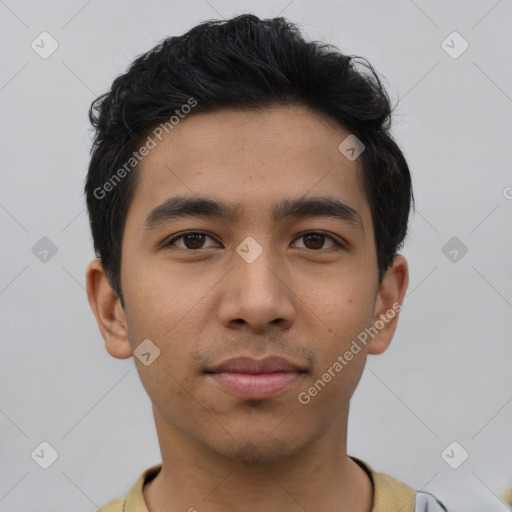 Joyful asian young-adult male with short  brown hair and brown eyes