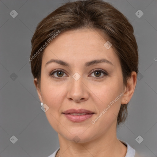 Joyful white adult female with short  brown hair and brown eyes