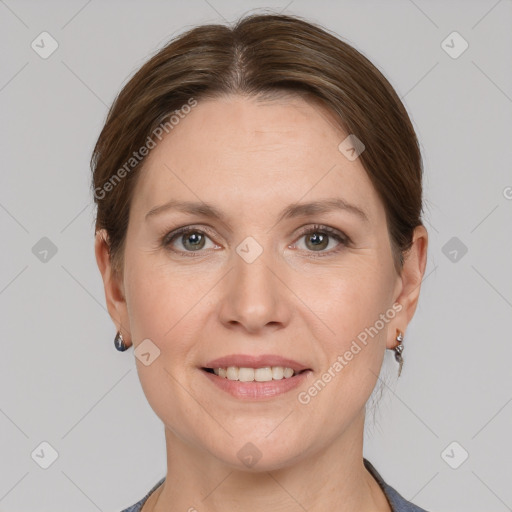 Joyful white adult female with short  brown hair and grey eyes