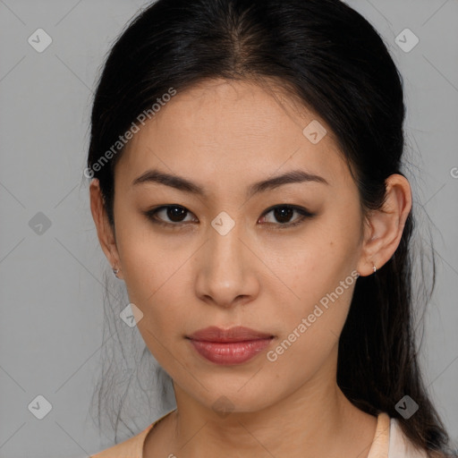 Joyful asian young-adult female with long  brown hair and brown eyes