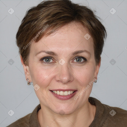 Joyful white adult female with short  brown hair and grey eyes