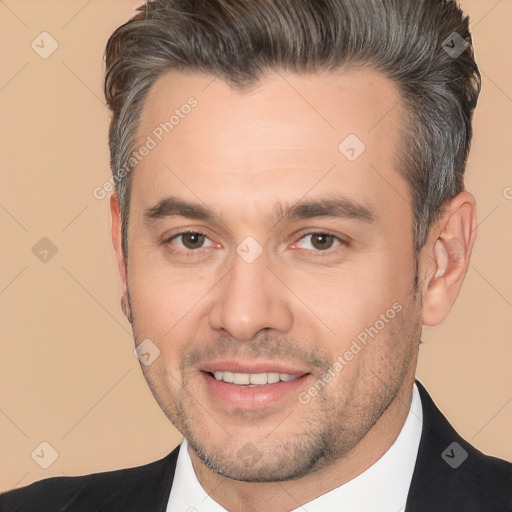 Joyful white adult male with short  brown hair and brown eyes