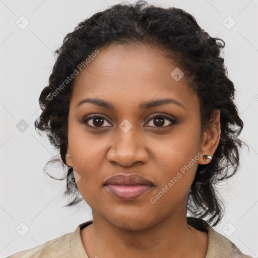 Joyful black young-adult female with long  brown hair and brown eyes