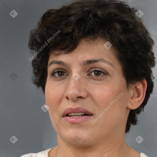 Joyful white adult female with short  brown hair and brown eyes