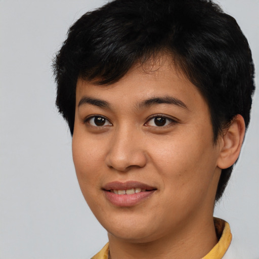 Joyful asian young-adult female with short  brown hair and brown eyes