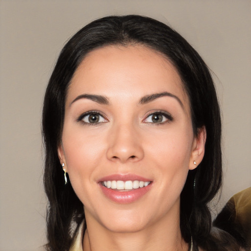 Joyful white young-adult female with medium  black hair and brown eyes