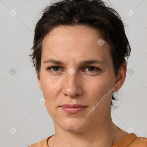 Joyful white adult female with short  brown hair and brown eyes